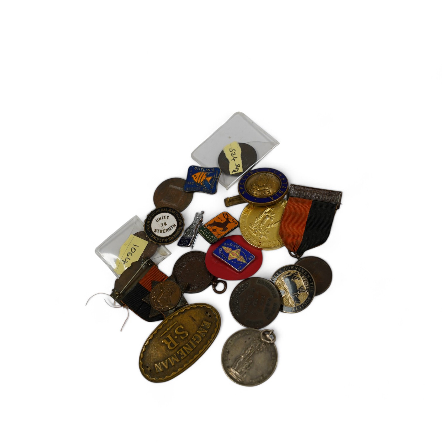 A group of assorted tokens, medallions and badges